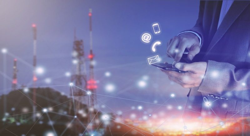 Digital contact icons over a hand holding a phone